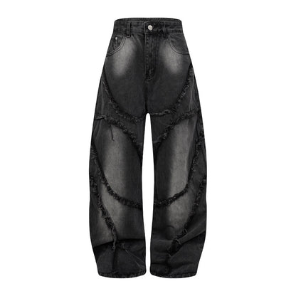 Pantalon style heavy industry, délavé et vieilli, coupe droite et large, avec ourlet effiloché