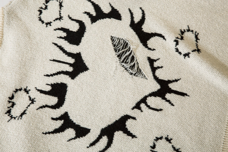 Pull déchiré avec motif cœur