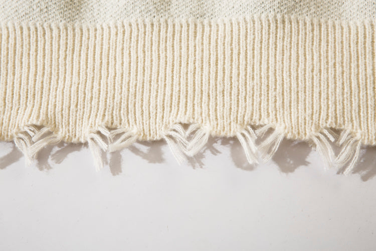 Pull déchiré avec motif cœur