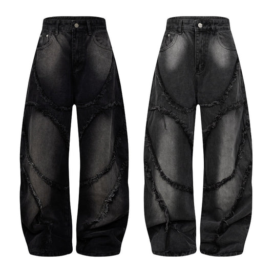 Pantalon style heavy industry, délavé et vieilli, coupe droite et large, avec ourlet effiloché