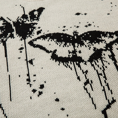 Pull avec motif papillon et effet éclaboussure d’encre