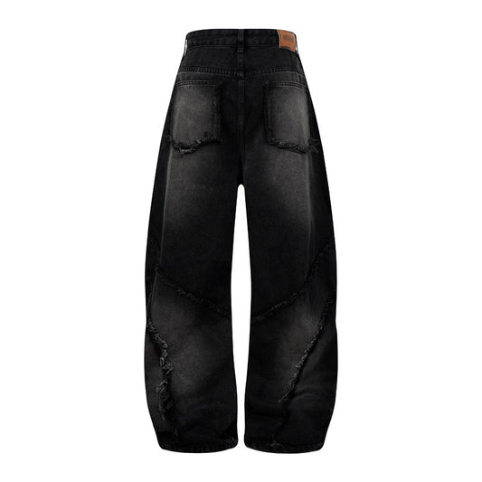 Pantalon style heavy industry, délavé et vieilli, coupe droite et large, avec ourlet effiloché