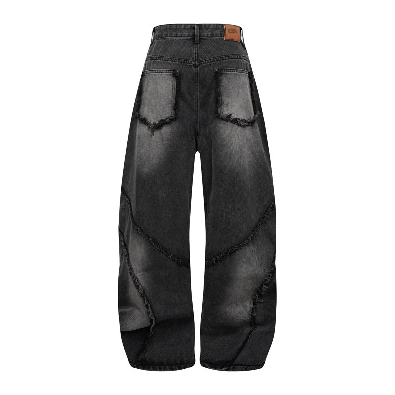 Pantalon style heavy industry, délavé et vieilli, coupe droite et large, avec ourlet effiloché