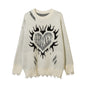 Pull déchiré avec motif cœur
