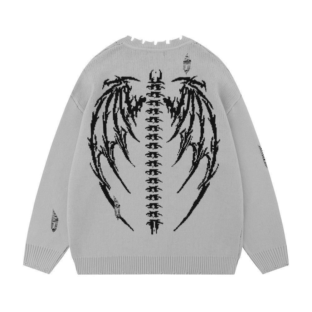 Pull déchiré avec motif squelette draconique